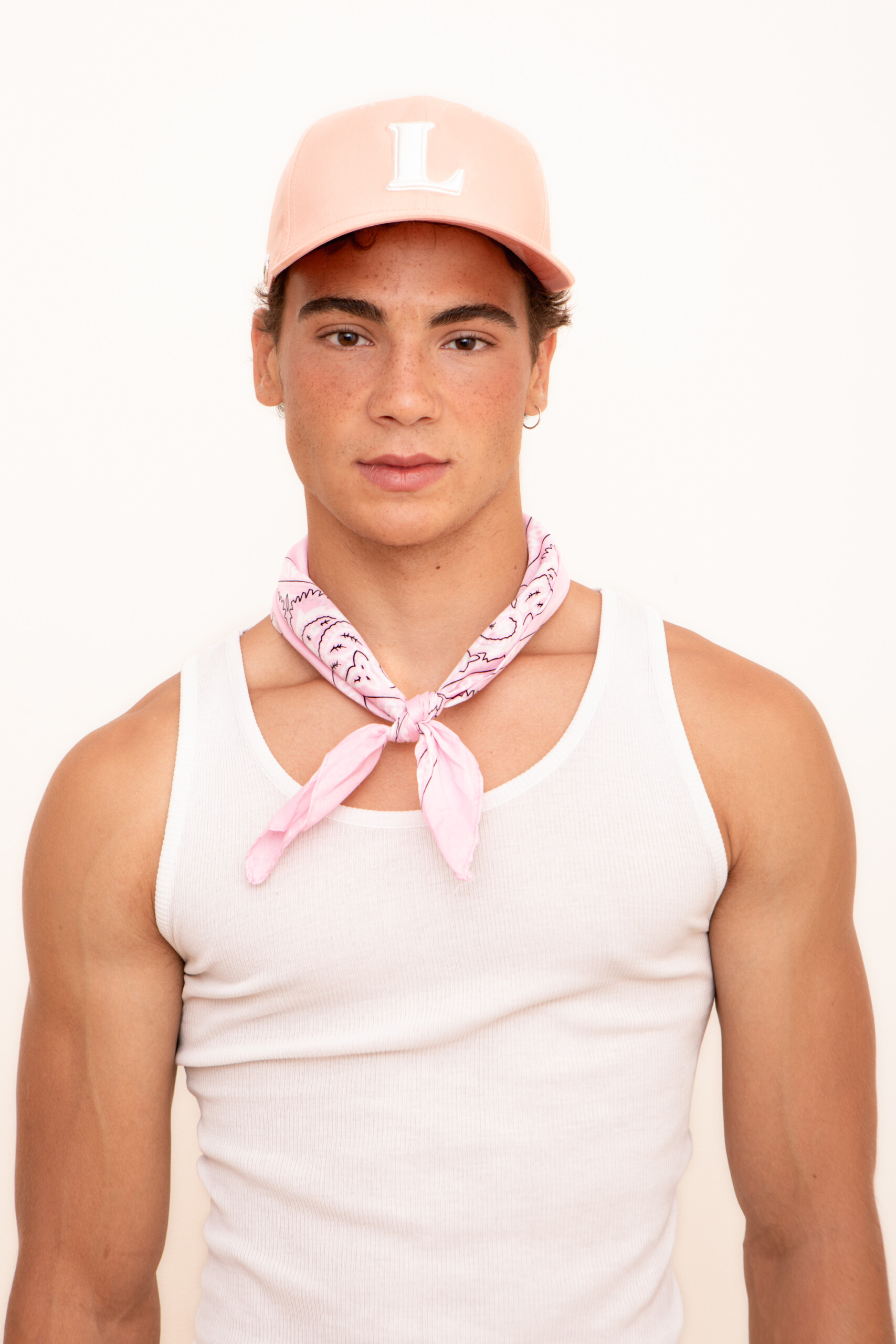 Tomás Gasso in a Lacoste cap and knotted Levi's handkerchief