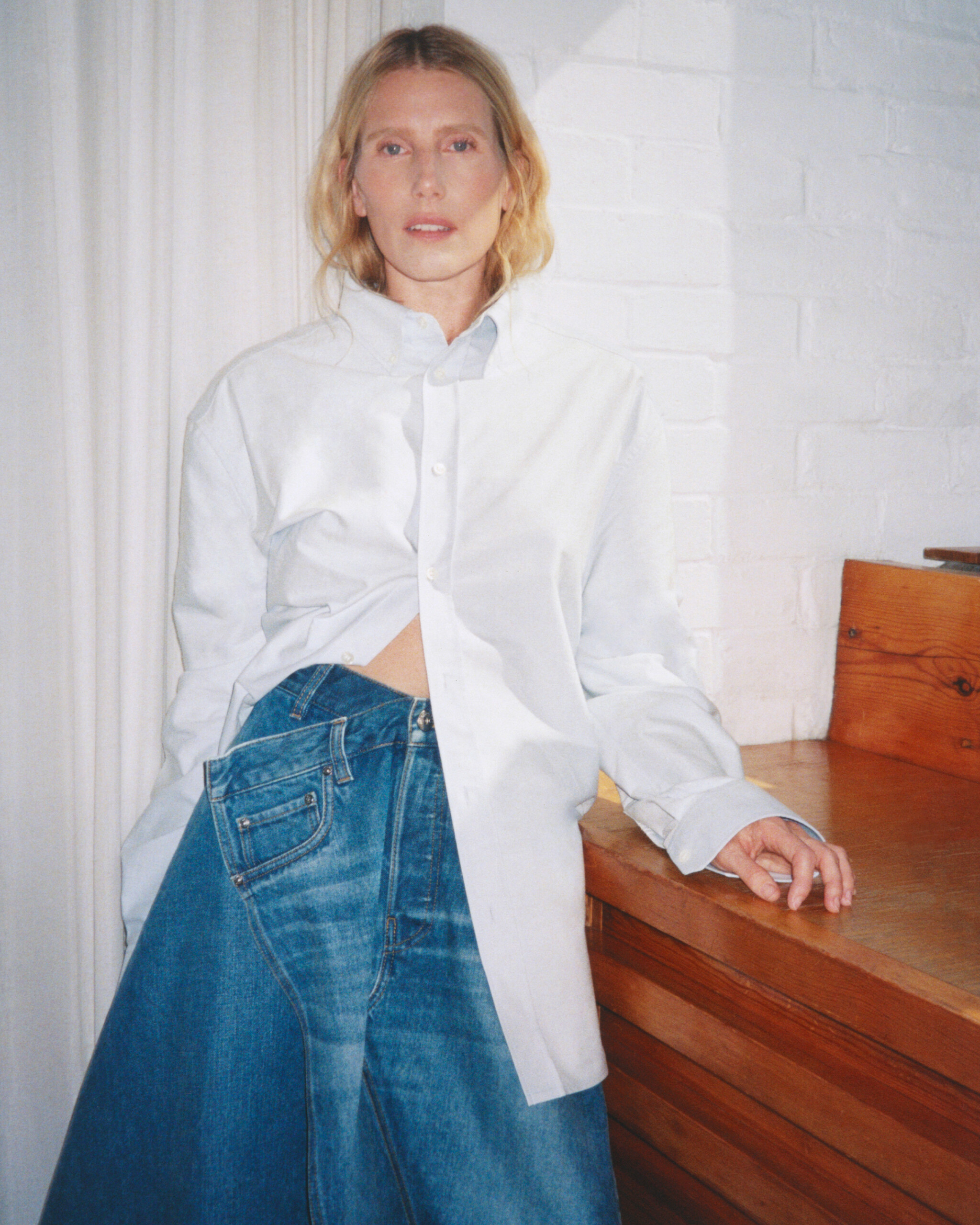 Dree Hemingway in an oversized shirt over a JW Anderson twisted denim skirt