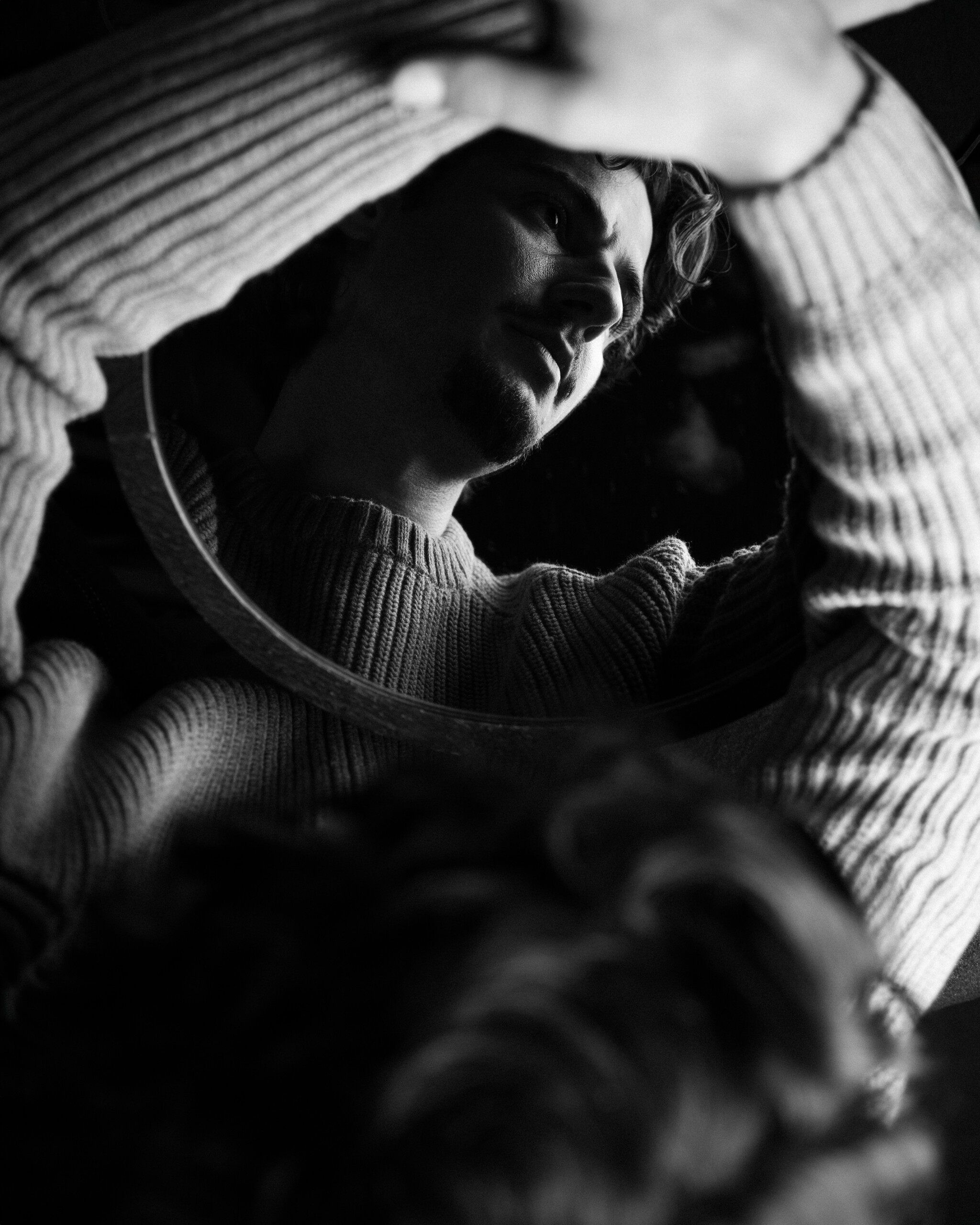Jack Brett Anderson reflected in a hand mirror