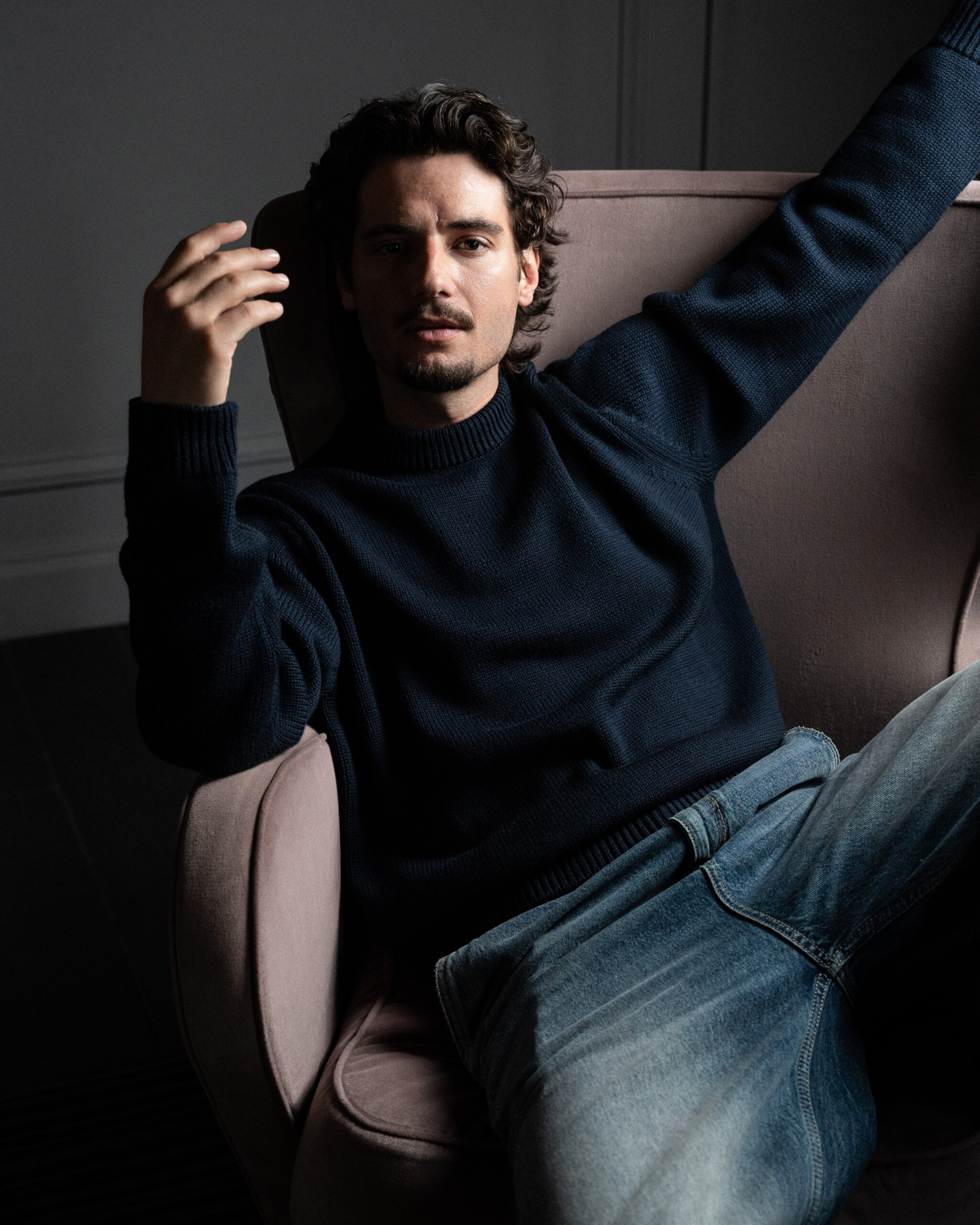 Jack Brett Anderson in a Ronning jumper, seated